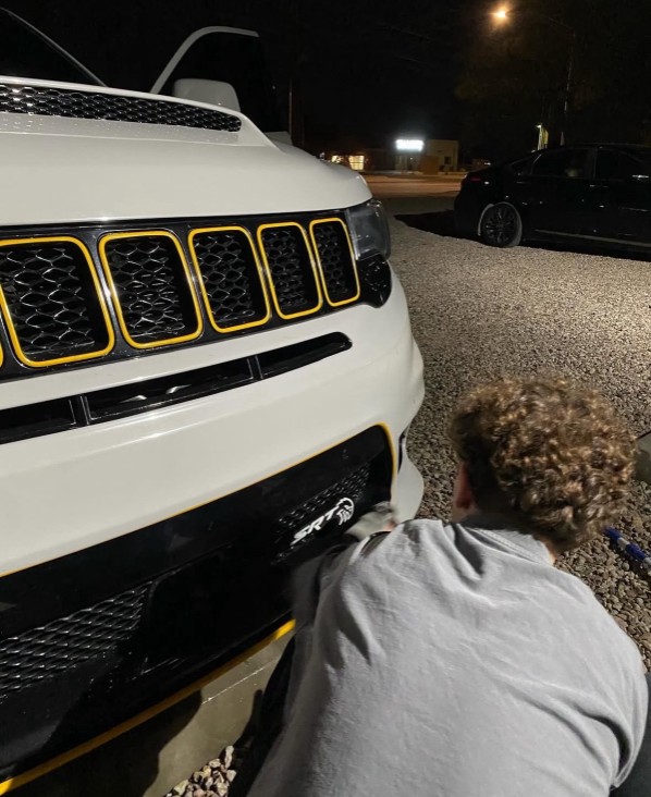 Cameron DeBough detailing a car